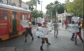 The Newsies hop off the Red Car Trolley to sell their papers